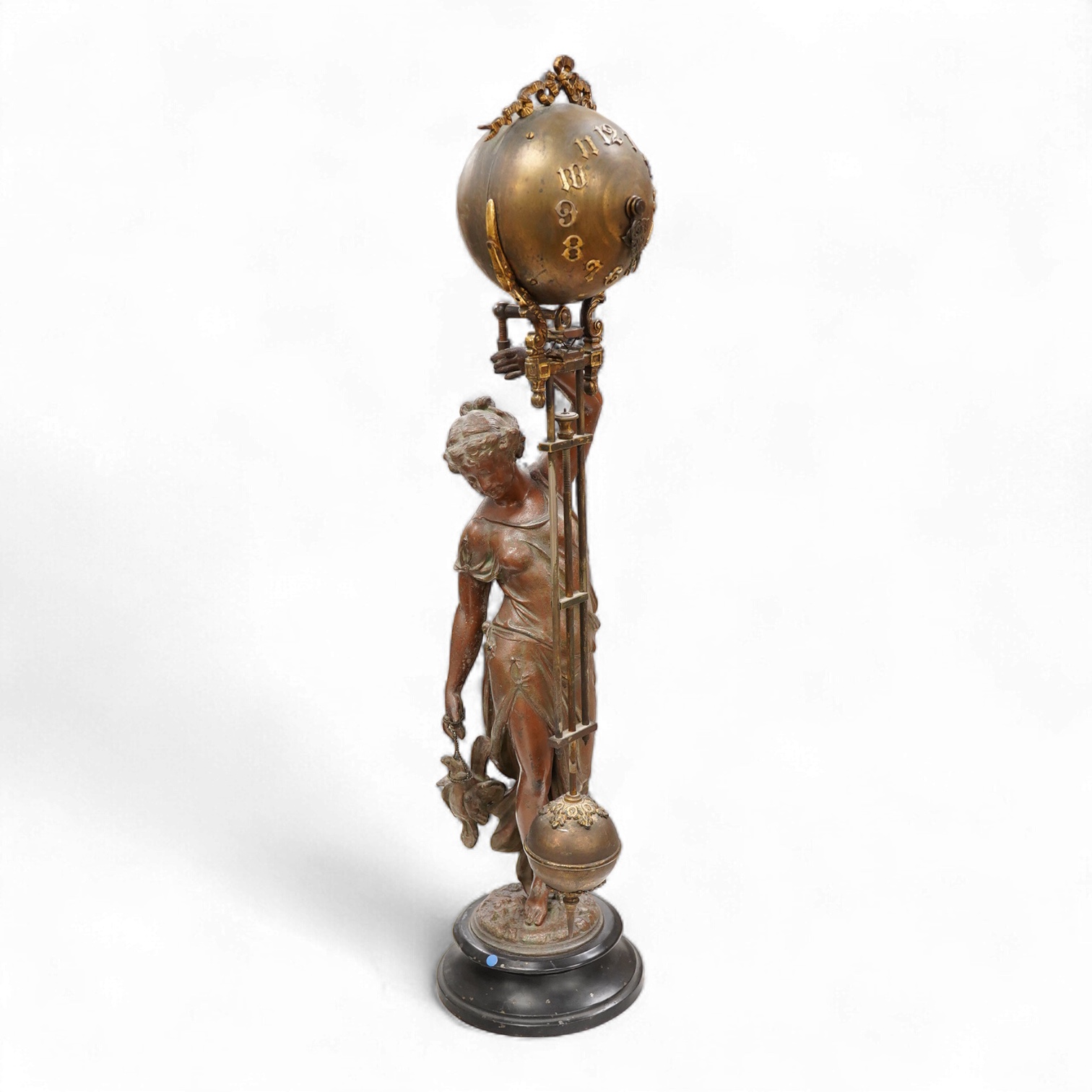 A late 19th century spelter figural mystery clock, 63cm high